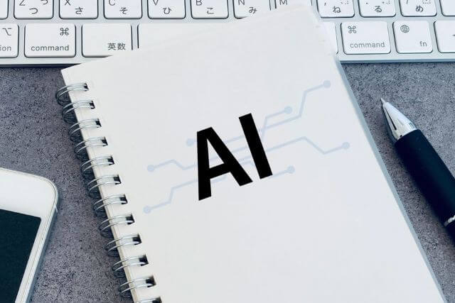 A notebook and pen representing AI technology